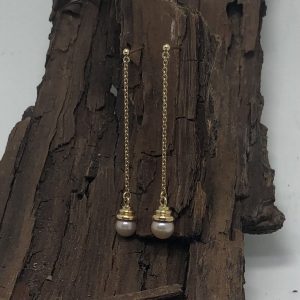 Lange oorbellen met roze parel