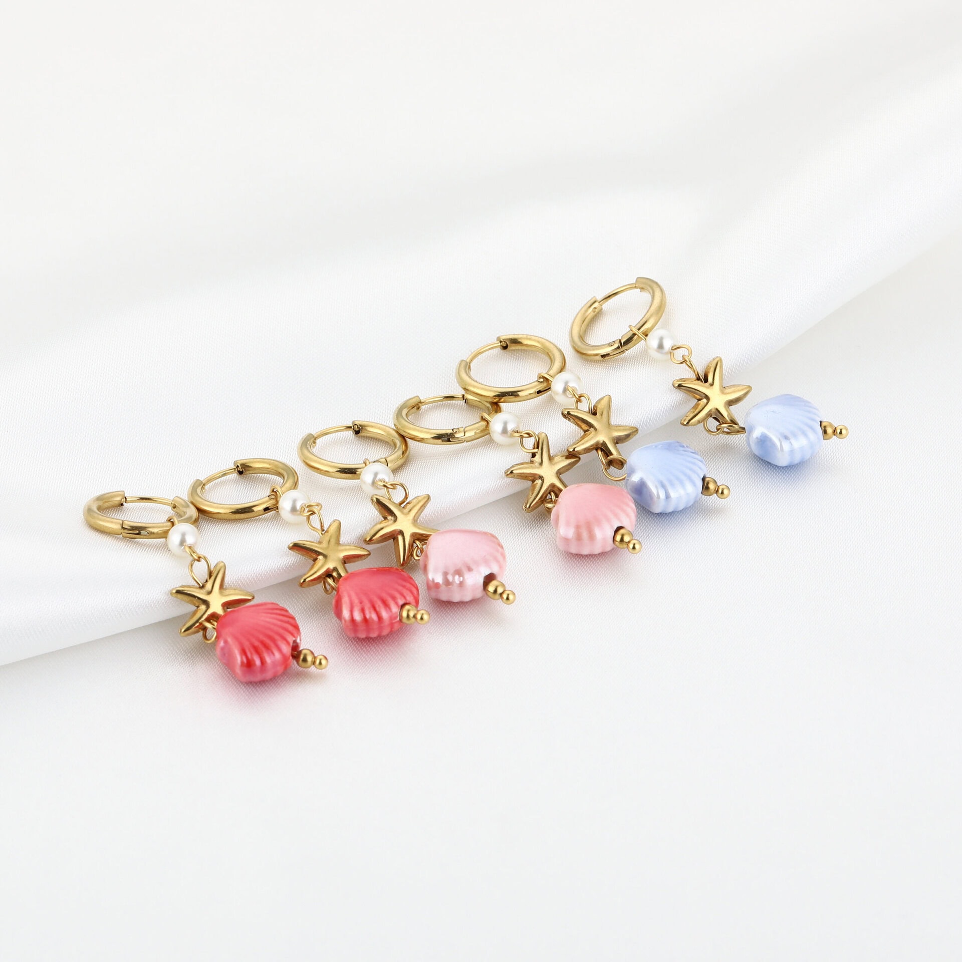 Oorbellen zeester en schelp